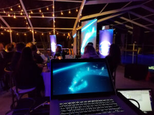 Evening corporate event with stage lighting, video projection, and AV support by Lucas Productions USA