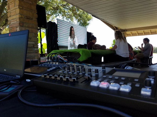 Outdoor omnicell event with LED screen and live sound mixing