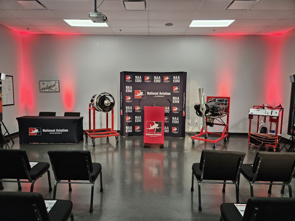 National Aviation Academy event with Lucas Productions USA AV setup, branded backdrop, and stage lighting