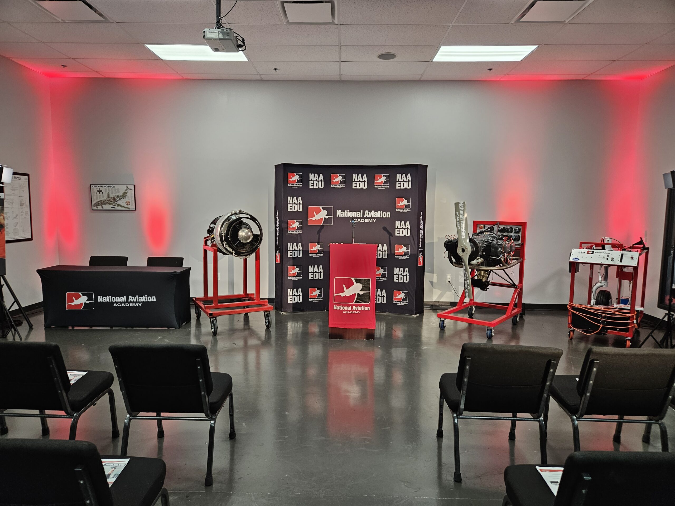 National Aviation Academy event with Lucas Productions USA AV setup, branded backdrop, and stage lighting